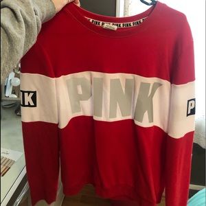 red and white sweatshirt from pink